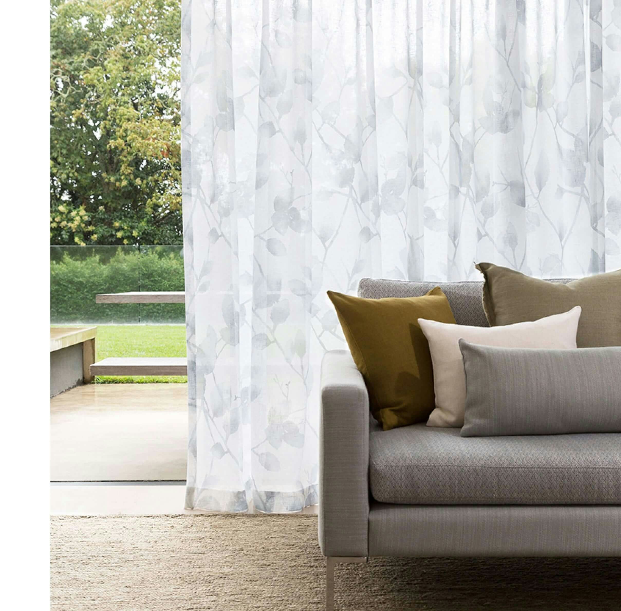 silver and white leaf foliage pattern sheer curtains in modern lounge room