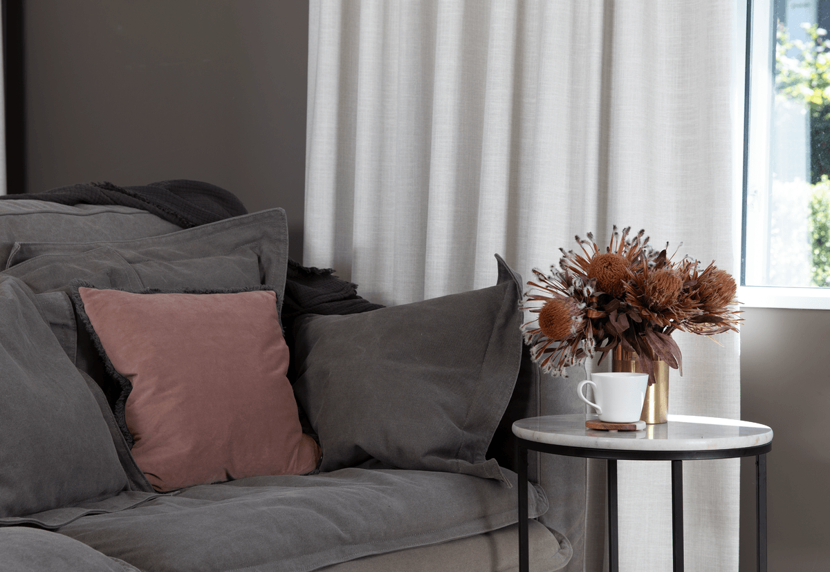 white curtains in contemporary lounge room on brown walls