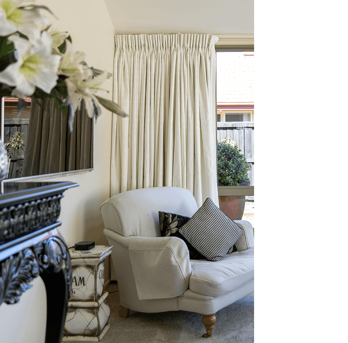 White curtains on light walls in living room