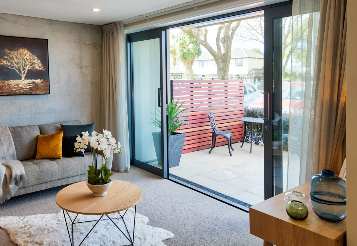 beige curtains in modern cosy industrial lounge room on concrete texture grey walls