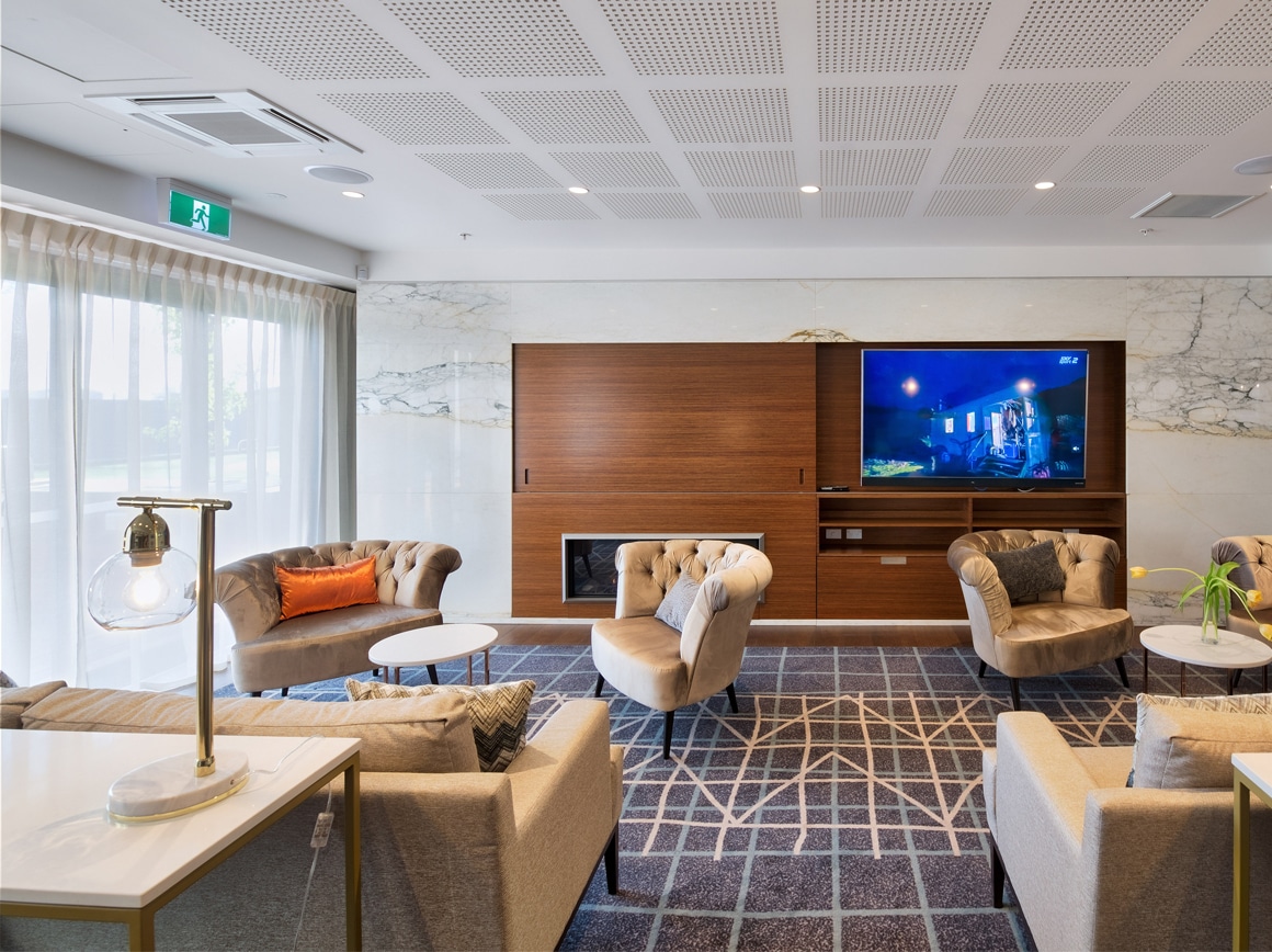 white sheer curtains in park lane retirement village lounge room on white walls
