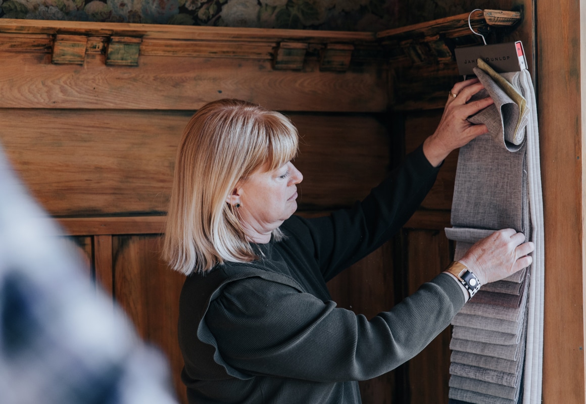 Russells consultant holding samples in home