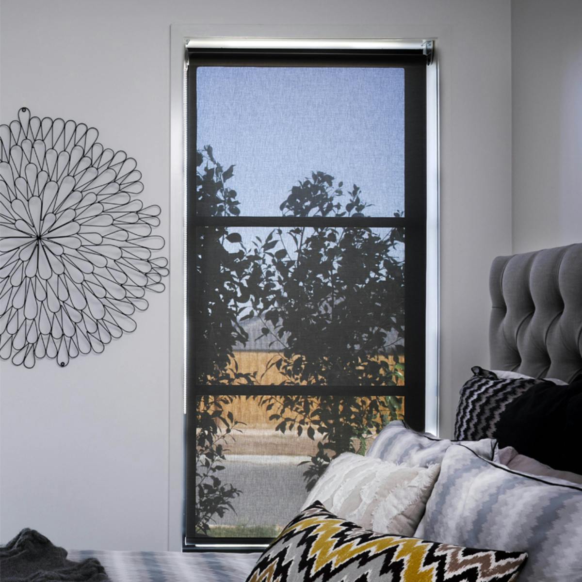 black sunscreen roller blinds in contemporary bedroom on white walls, wall blinds
