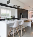 white shutters in modern minimal kitche on white walls and black cabinets