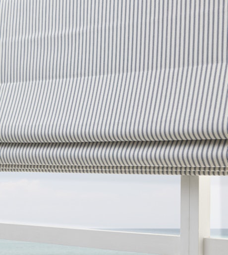 grey and white thin stripe blinds closeup