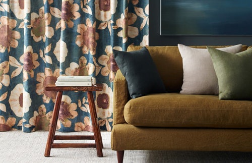 dark teal beige brown floral pattern curtains in contemporary lounge room on dark blue walls
