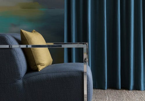 navy blue curtains in contemporary lounge room on yellow teal blue grey walls