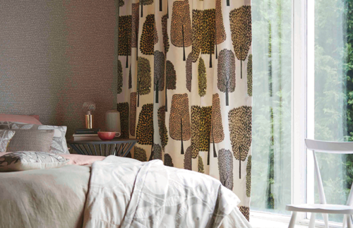 Cream curtains with brown trees in bedroom