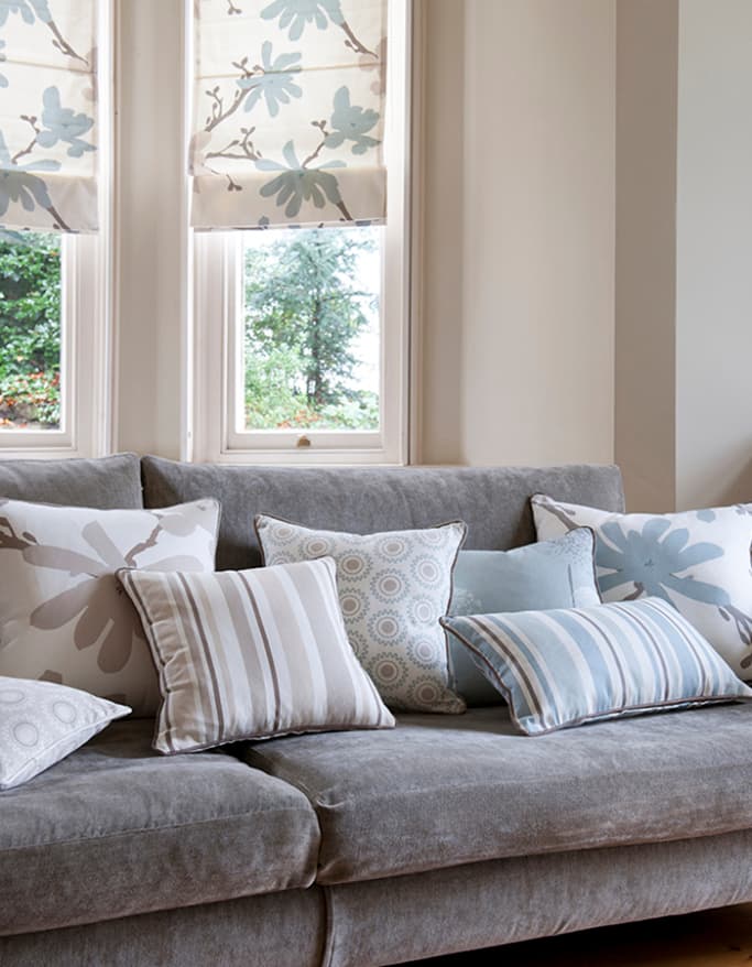 brown white pale blue floral branch pattern roman blinds in contemporary homely lounge on white walls