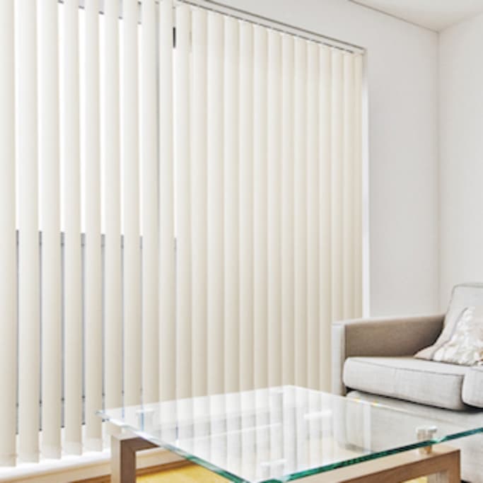 white vertical blinds in contemporary lounge room on white walls