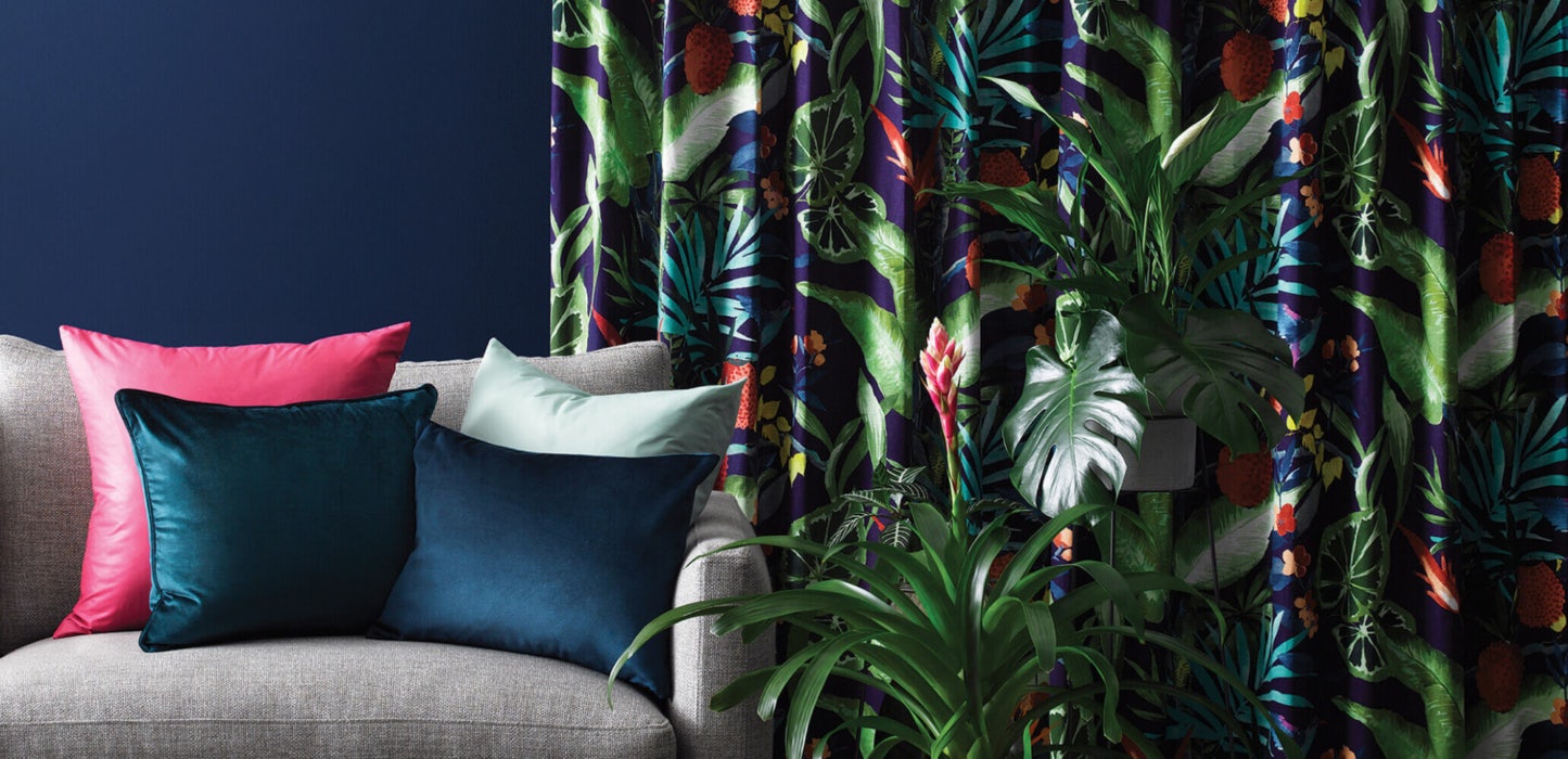 purple green red foliage leaf tropical pattern curtains in contemporary lounge room on dark navy blue walls
