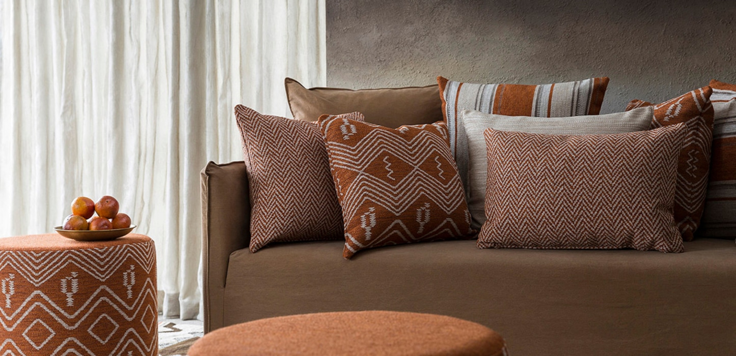 white sheer curtains in african modern lounge room on brown textured walls