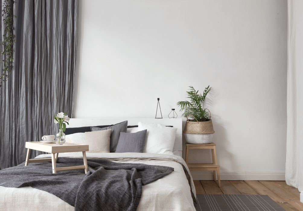 Long dark grey curtains in a bedroom