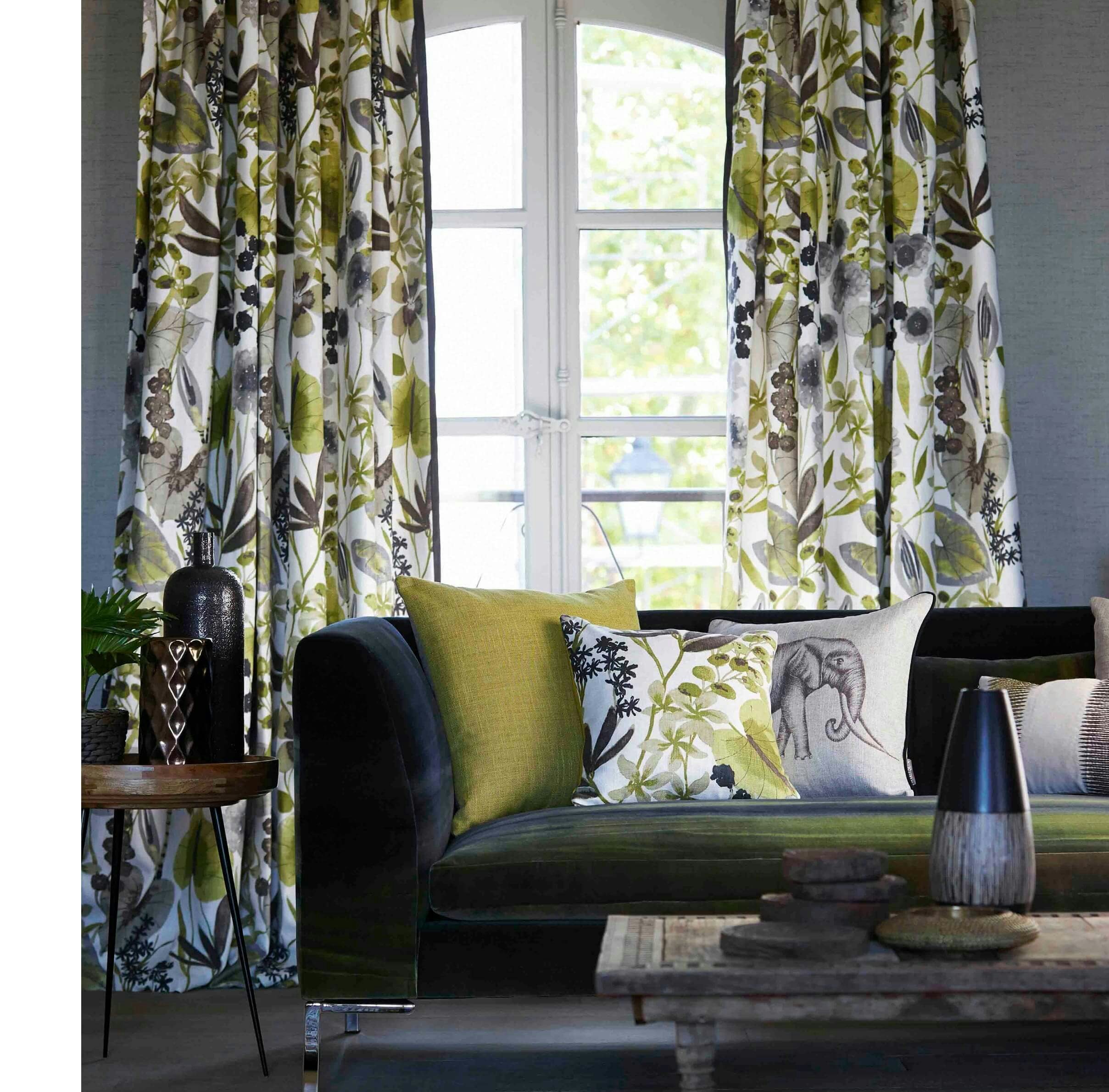 green blue white foliage leaf pattern curtains in contemporary lounge on grey blue walls