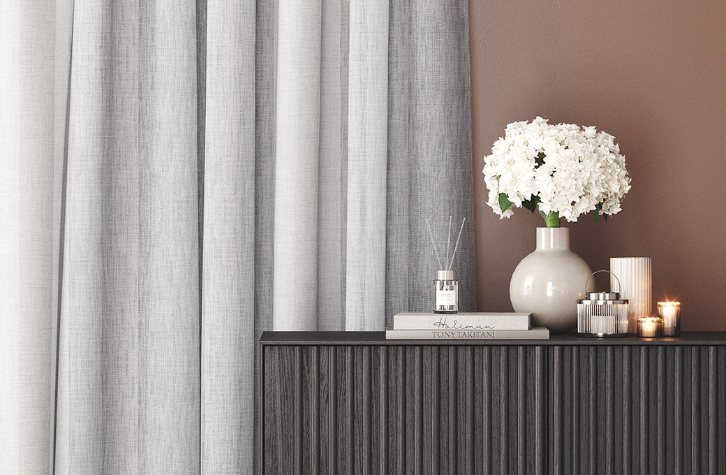 grey textured curtains in contemporary simple room on brown walls