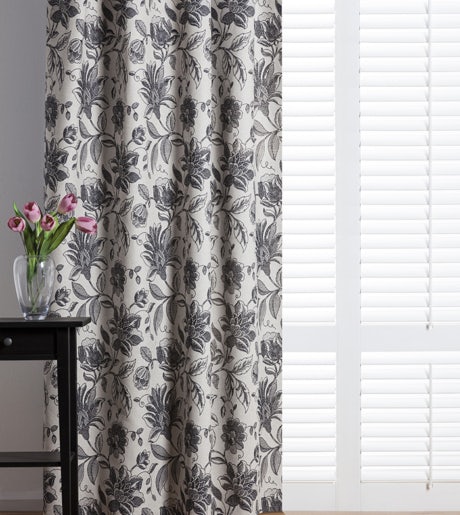 Dark grey floral curtains with white shutter