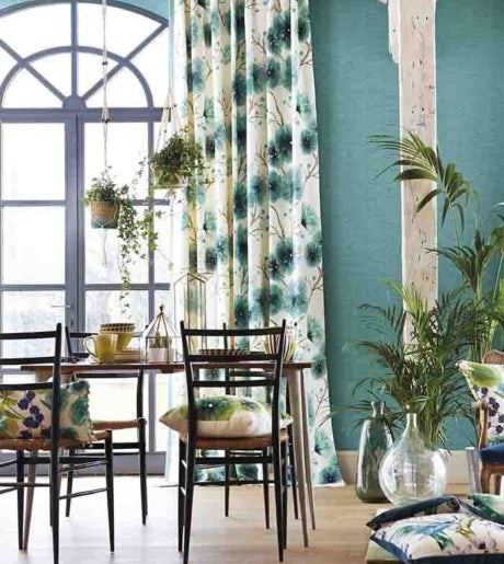 teal floral branch pattern curtains in boho dining room on teal walls