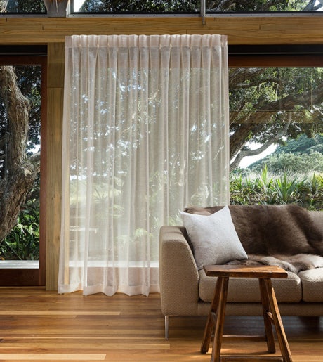 beige sheer curtains in modern beachy lounge room