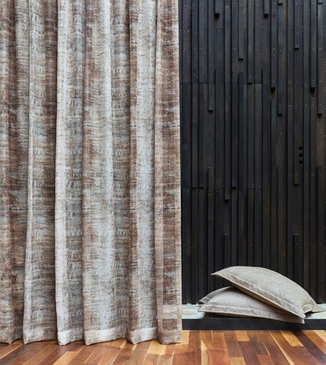 brown and grey industrial textured curtains on black timber walls