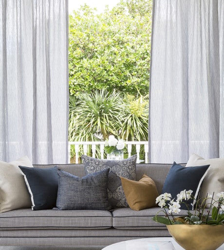 grey wave pattern textured curtains in contemporary lounge room on white window frames