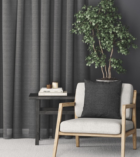 dark grey curtains in calm modern lounge room on dark grey walls