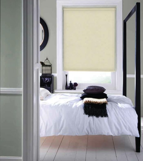 beige blockout roller blinds in contemporary bedroom on mint green walls