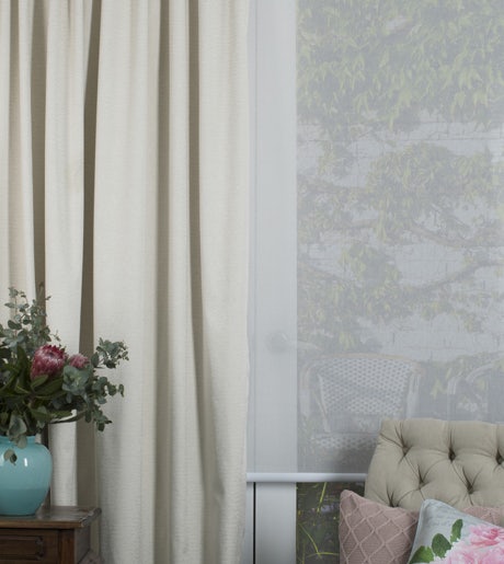 beige curtains white roller blinds in traditional lounge room