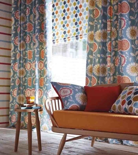 blue gold orange white colourful floral pattern curtains in colourful vintage lounge room