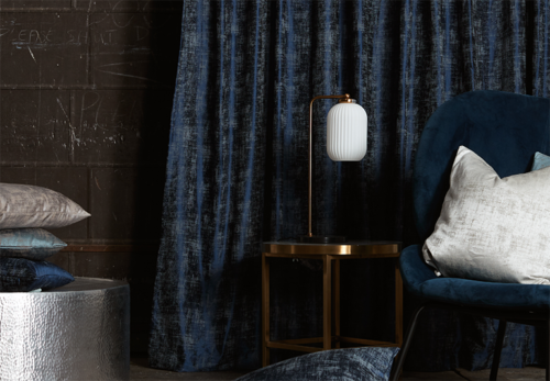 navy blue velvet curtains in moody contemporary lounge room on black walls