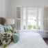 White long plantation shutters bedroom