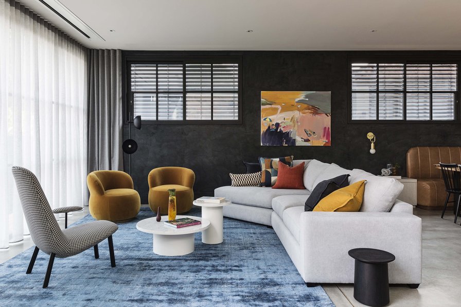 Neutral curtains coordinating an open-plan living space