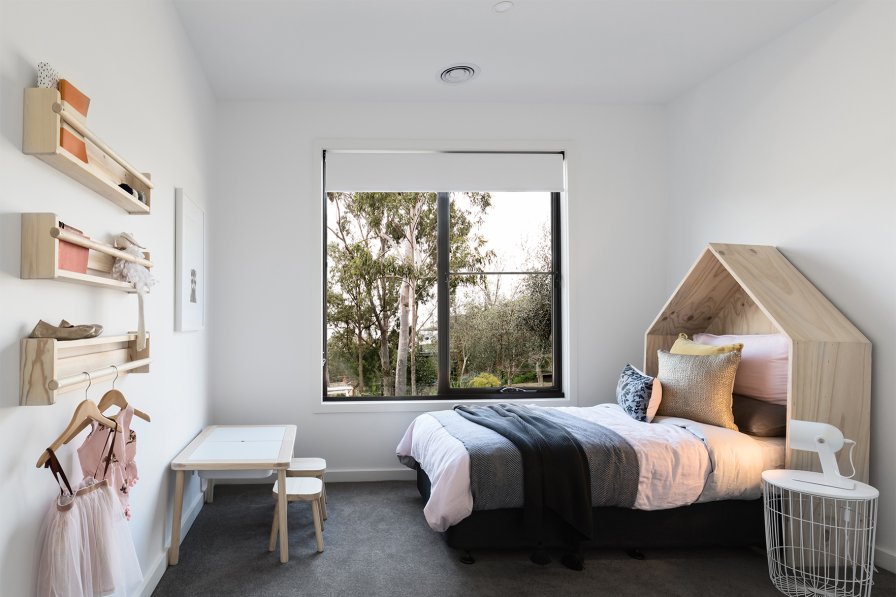 Blinds in a calm, light-controlled bedroom