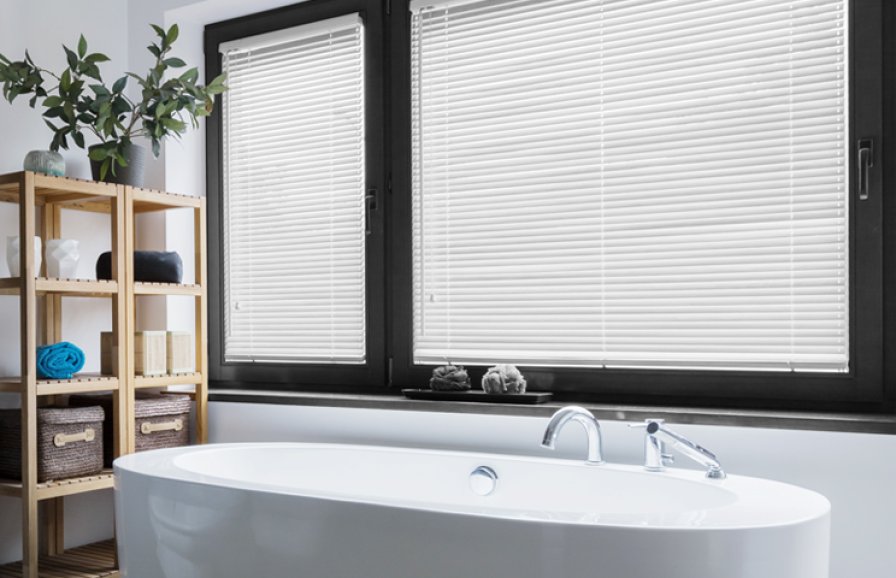 Blockout blind fitted to a bedroom window for better sleep