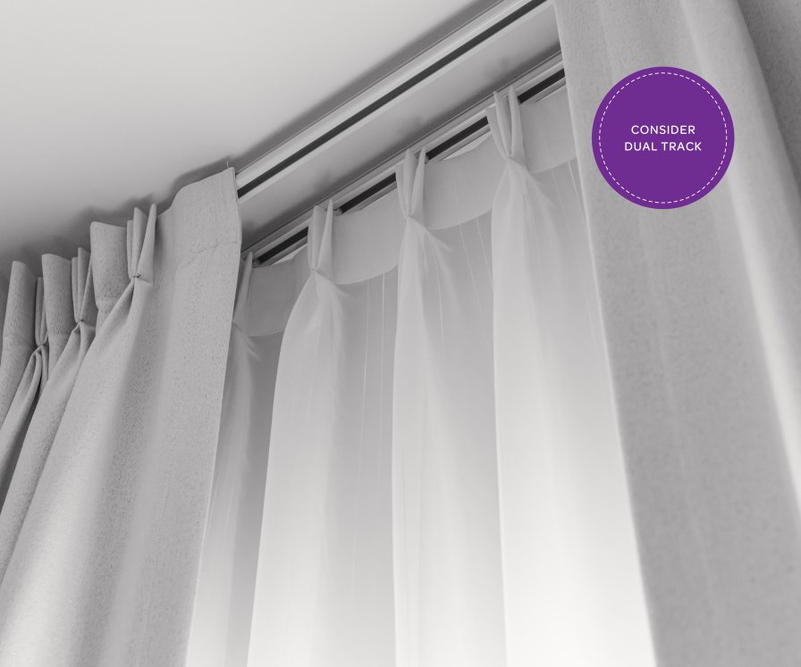 Close-up of two parallel curtain tracks with sheer and opaque white layers, labelled 