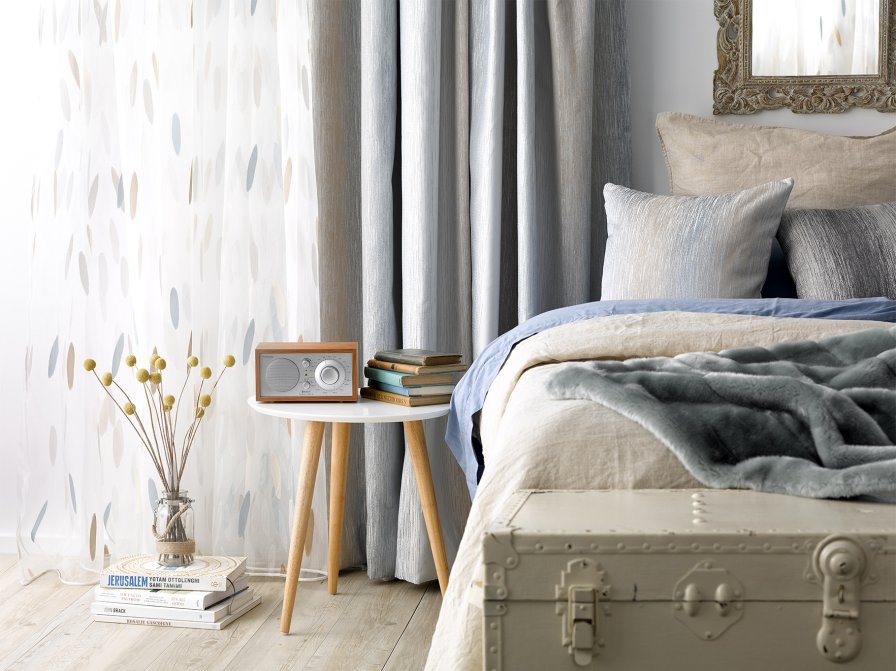 Soft neutral curtain fabric suited to a calm guest room