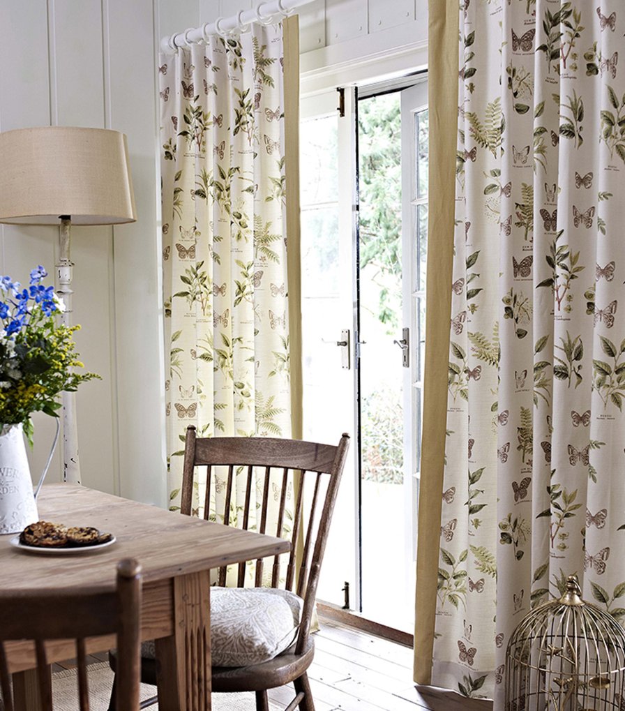 Curtain fabric in oyster grey suited to a villa interior