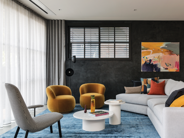 Dark grey living room with white sheer curtains ceiling-mounted beside an upper-window shutter.