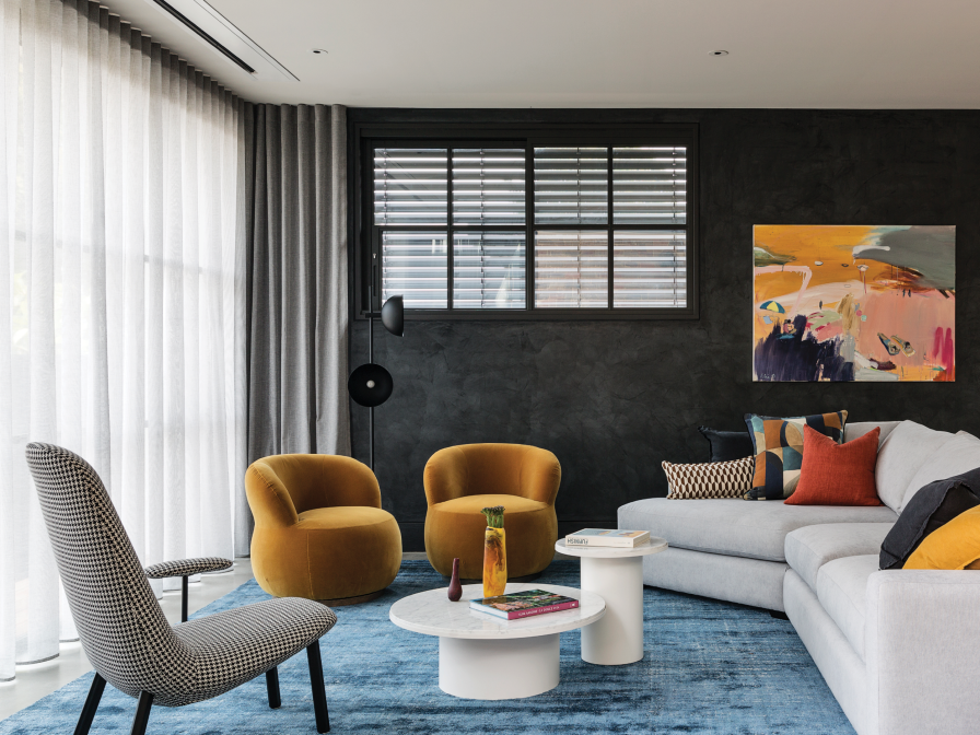 Dark grey living room with white sheer curtains ceiling-mounted beside an upper-window shutter.