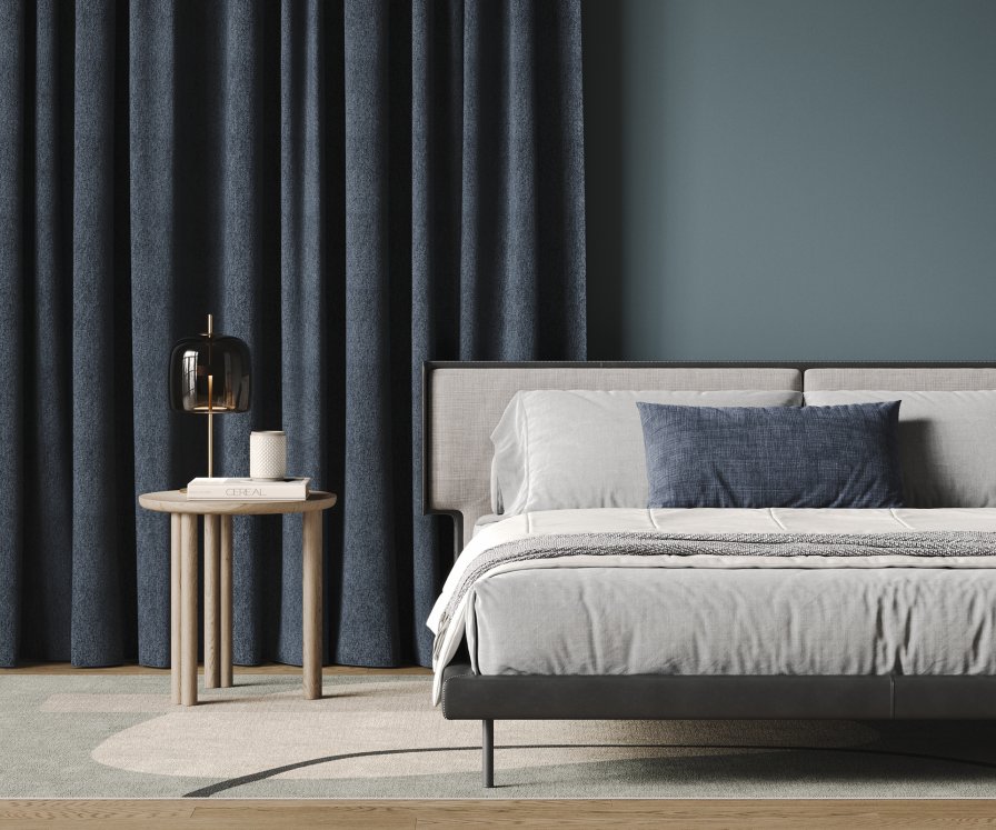 Blockout curtains darkening a bedroom