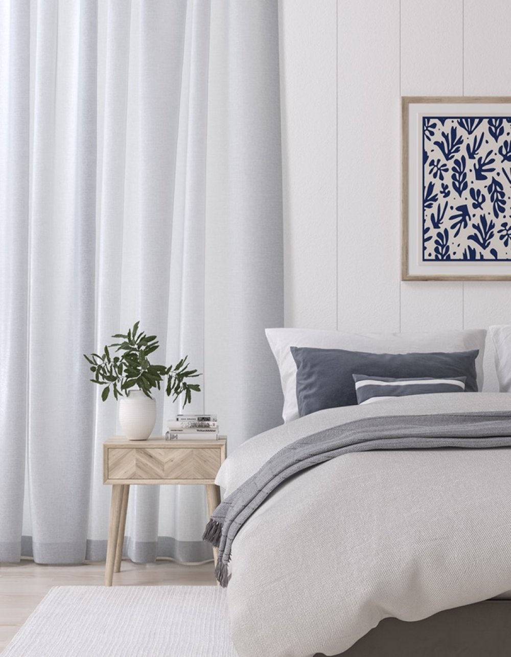 Pale blue-white curtains in a bedroom with a light wood bedside table and plant.