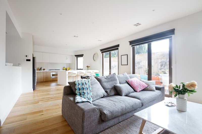 Roller blinds in a bright, contemporary living space