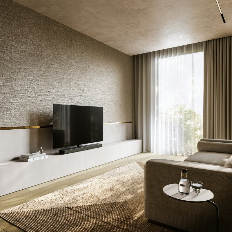 Contemporary living room with tan sheer curtains on a large window and a brown sofa.