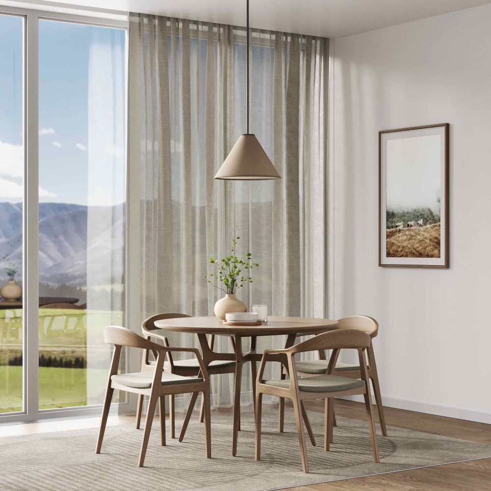 Pale creamy-beige curtains by a bedroom window with a rural landscape view.