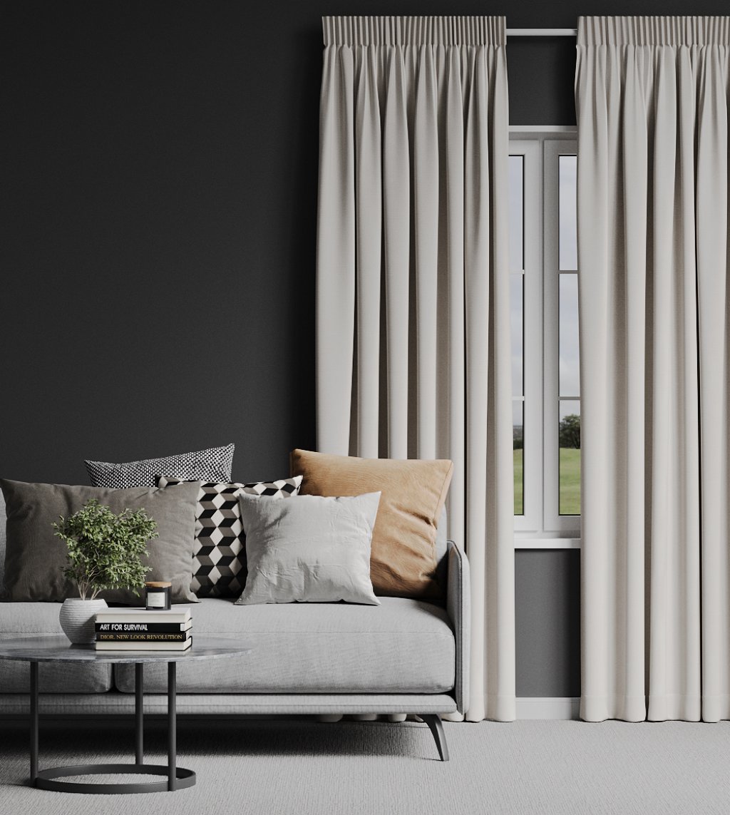 Modern living room with pale cream curtains on either side of a dark glass door.