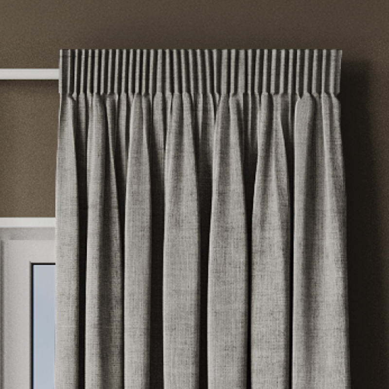 Grey linen curtains with a pencil pleat heading showing the gathered folds along the top.