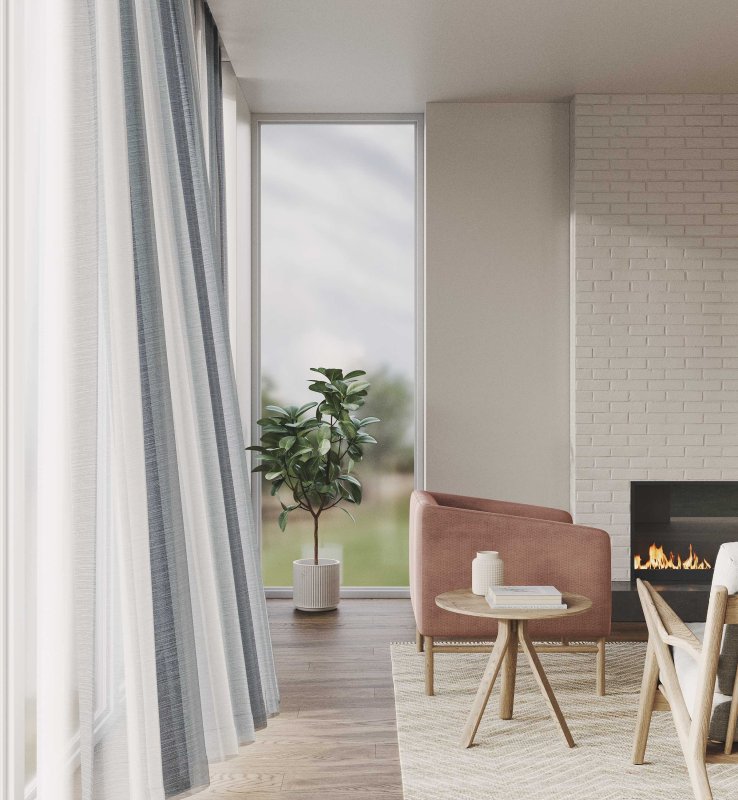 Blue-grey linen curtains with a white sheer overlay framing a room with a fireplace.